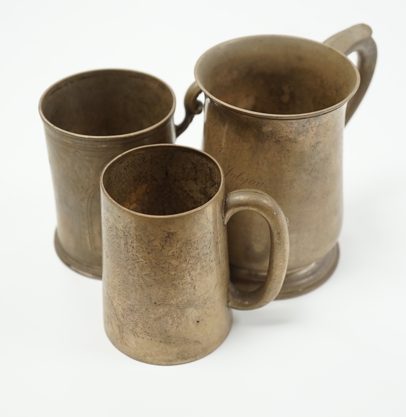 A Victorian engraved silver christening mug, The Barnards, London, 1871, 82mm and two later silver mugs, 14oz.